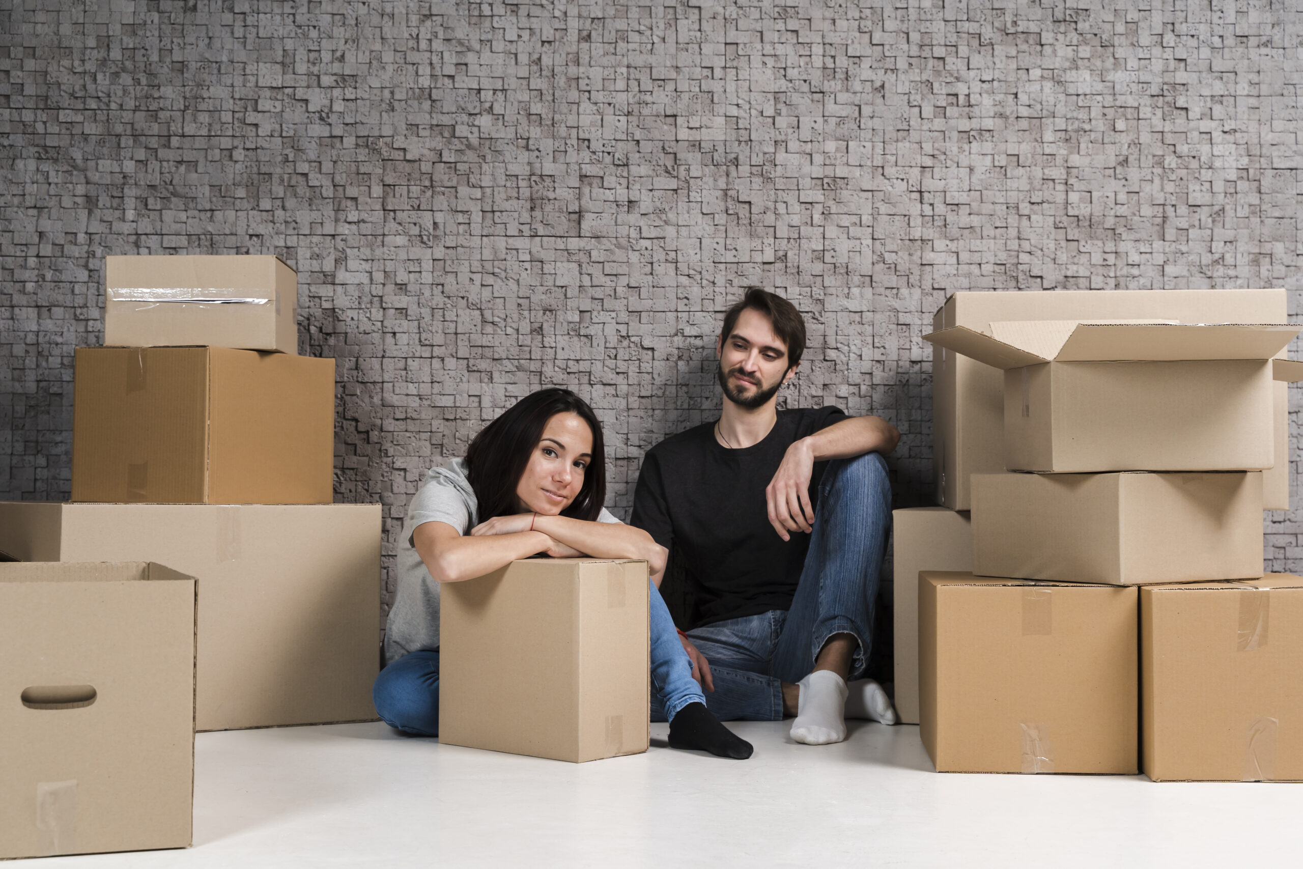 young-man-woman-preparing-boxes-relocation